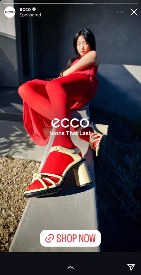 A woman in a red outfit poses outdoors on a concrete ledge, showcasing red and beige platform sandals. The image is overlaid with the ECCO logo and a "SHOP NOW" button.