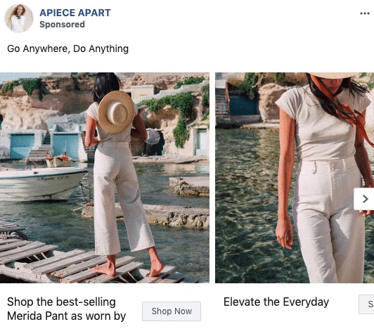 A woman stands on a wooden dock holding a hat, wearing high-waisted white pants and a white top, near a boat and water on a sunny day.