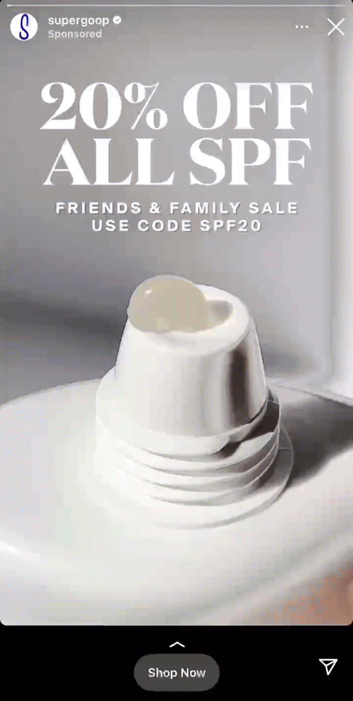Close-up of a sunscreen bottle with cream on the nozzle, advertising "20% off all SPF" and featuring a promo code for a friends and family sale.