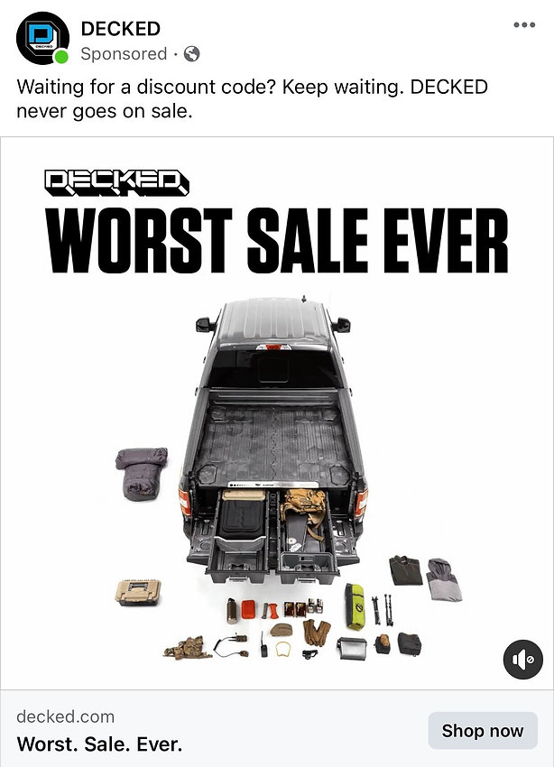 A pickup truck with an open tailgate shows organized storage drawers and various outdoor gear arranged on the ground behind it. Text above reads "WORST SALE EVER.