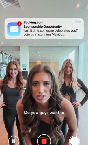 Three women in workout clothes face the camera in a gym, with a mobile notification about a Mexico sponsorship opportunity displayed at the top of the image.