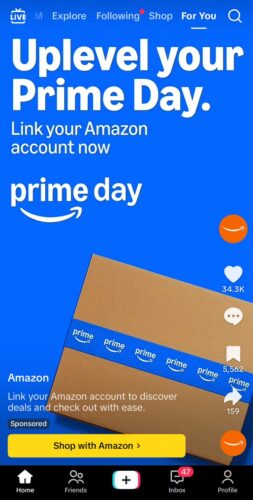Amazon Prime Day promotion screen with a brown Amazon package wrapped in blue Prime tape and text encouraging users to link their Amazon account for deals.