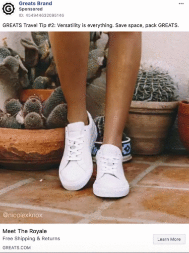 A person wearing white sneakers stands on a tiled patio near potted plants and cacti.