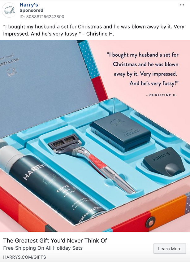 Open Harry's gift set featuring a razor, shaving gel, blade refills, and a travel cover, displayed in a blue and red box with a customer testimonial in the background.