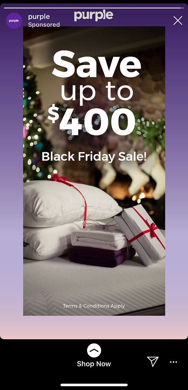 An advertisement for Purple's Black Friday Sale, offering up to $400 off, with pillows, a mattress, and gift boxes displayed in front of a lit Christmas tree.
