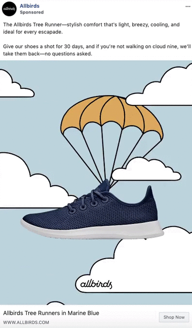 A navy blue sneaker with white soles descends from the sky with a parachute against a light blue background with clouds.