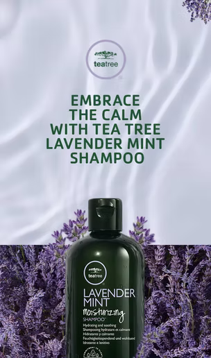 A bottle of Tea Tree Lavender Mint Moisturizing Shampoo stands among lavender flowers, with text above promoting the product's calming qualities.