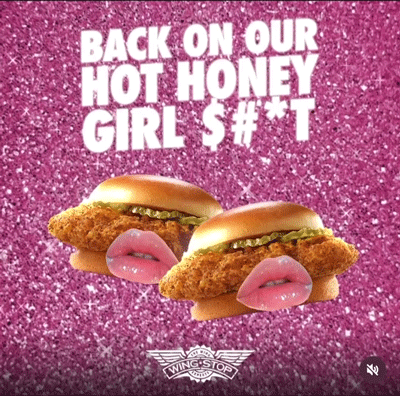 Two chicken sandwiches with illustrated lips in front of them, set against a glittery pink background with bold text reading, “BACK ON OUR HOT HONEY GIRL $ # * T.”.