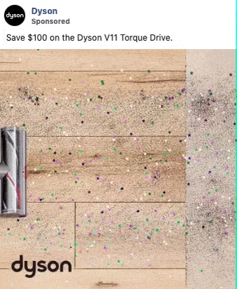 A Dyson vacuum cleans a floor covered with colorful confetti, leaving a clear line between the cleaned and dirty areas. Text reads: "Save $100 on the Dyson V11 Torque Drive.