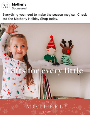 A young girl in holiday pajamas stands by a shelf with elf and reindeer plush toys. Text reads: "Gifts for every little. The Motherly Shop.