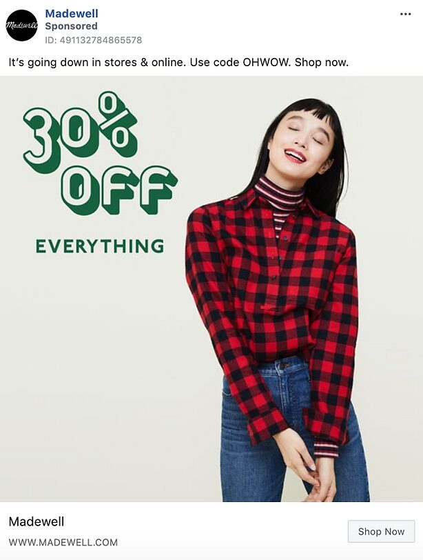 A woman in a red plaid shirt stands near a large "30% OFF EVERYTHING" sign on a light background in a Madewell sale advertisement.