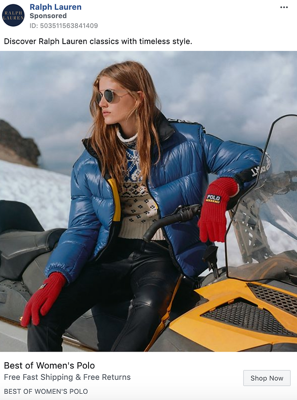 A woman wearing a blue puffer jacket, patterned sweater, red gloves, and sunglasses sits on a yellow snowmobile against a snowy background.