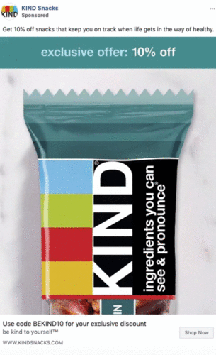 A KIND snack bar in colorful packaging is displayed with text offering a 10% discount and a promo code for an exclusive offer.