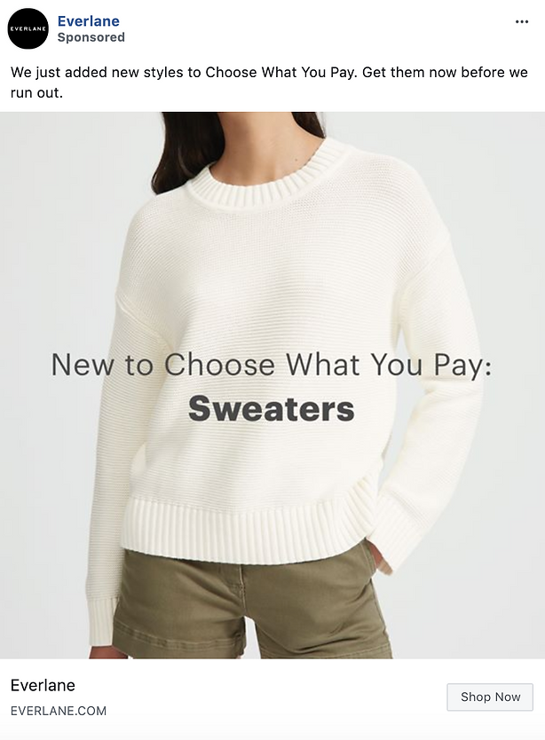 A person wears a white knit sweater and olive green pants. Text on image reads: "New to Choose What You Pay: Sweaters.