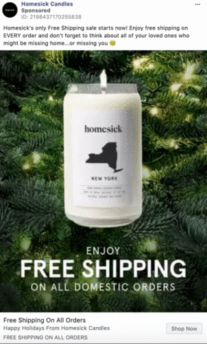 A Homesick New York candle sits on pine branches with text promoting free shipping on all domestic orders for the holidays.