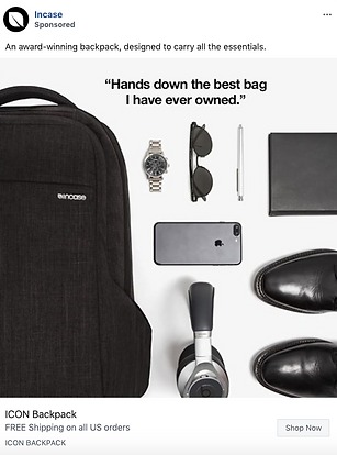 A black backpack next to a watch, sunglasses, notebook, smartphone, headphones, and black shoes arranged neatly on a white surface.