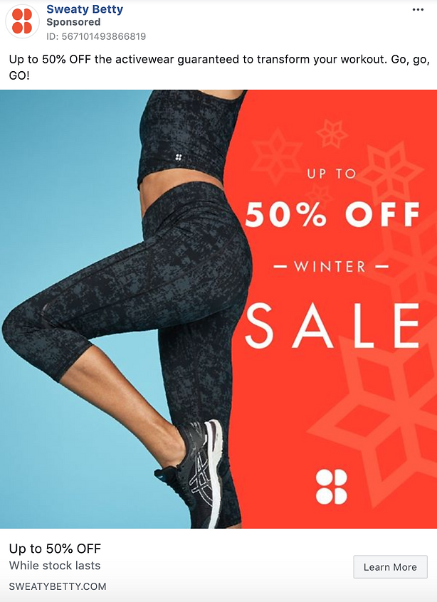 A person wearing black patterned activewear stands in front of a red background with text advertising up to 50% off a winter sale at Sweaty Betty.