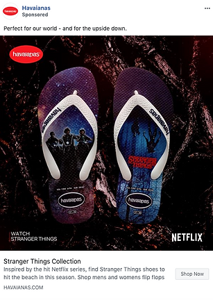 A pair of Havaianas flip-flops featuring Stranger Things designs, placed on a dark, textured surface, with Netflix and Havaianas logos visible.