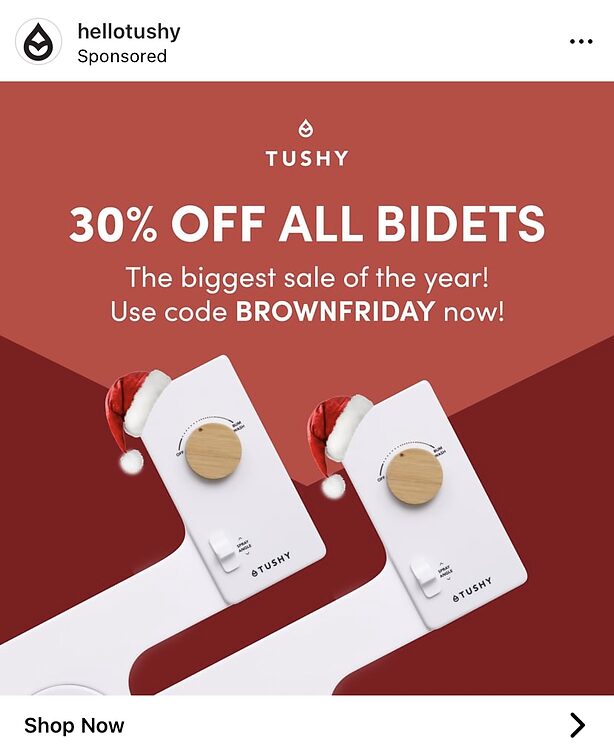 Advertisement showing two Tushy bidets with Santa hats, promoting 30% off all bidets for "Brown Friday" using a discount code.
