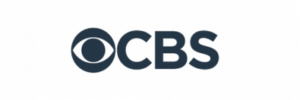 The image shows the CBS logo, featuring a stylized eye symbol followed by the letters "CBS" in bold, dark font on a light background.