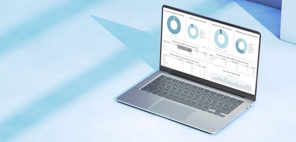 A laptop on a light blue surface displays data dashboards with charts, graphs, and tables on its screen.