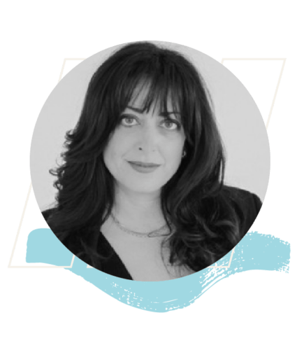 Black and white portrait of a woman with long dark hair and bangs, wearing a dark top, framed by a blue brushstroke graphic at the bottom.