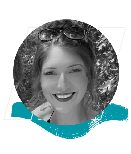 Black and white photo of a woman smiling outdoors, wearing sunglasses on her head, with a decorative teal brushstroke at the bottom of the image.