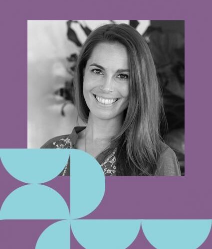 A woman with long hair smiles at the camera, framed by a purple border with geometric blue shapes in the bottom left and right corners.